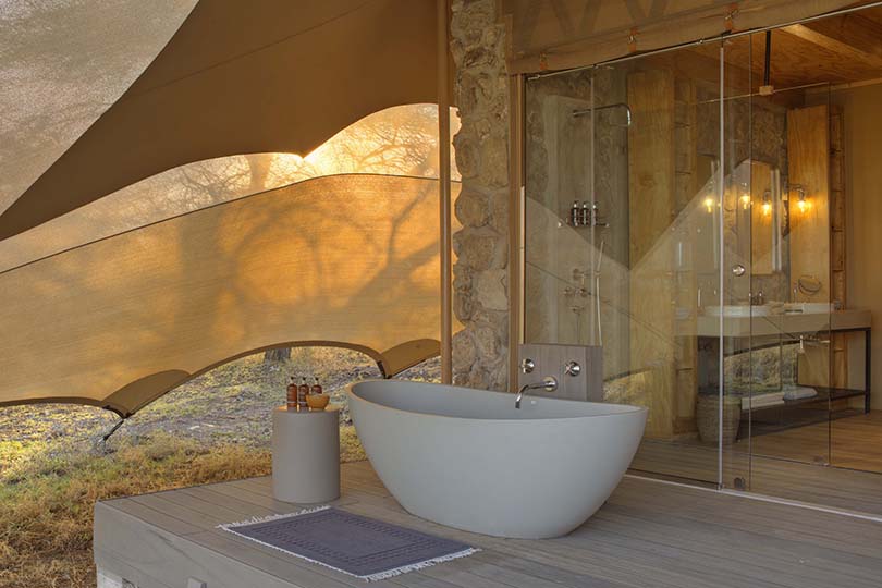 Namiri-Plains-Tent-deck-with-bath-and-shower-looking-onto-the-plains